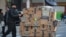 A delivery person pushes a cart full of Amazon boxes in New York City, U.S., Feb. 14, 2019.