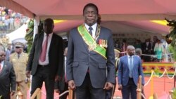 FILE: Zimbabwe's President Emmerson Mnangagwa prepares to inspect the guard of honour at the National Sports Staduim in Harare, Wednesday, April, 18, 2018.