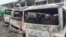FILE - Burned buses are seen at the bus terminal in Buea, Cameroon, July 10, 2018. Gunfire broke out in the capital of a western region of Cameroon gripped by violence between anglophone separatists and security forces.