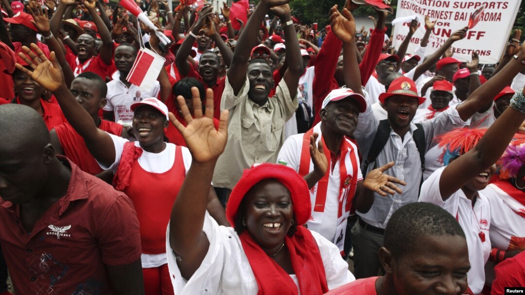 Supporters of the ruling All People's Congress party's President Ernest Bai Koroma attend a rally outside State House in the center of Sierra Leone's capital Freetown, October 11, 2012. 