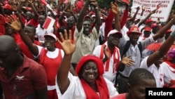 Supporters of the ruling All People's Congress party's President Ernest Bai Koroma attend a rally outside State House in the center of Sierra Leone's capital Freetown, October 11, 2012. 