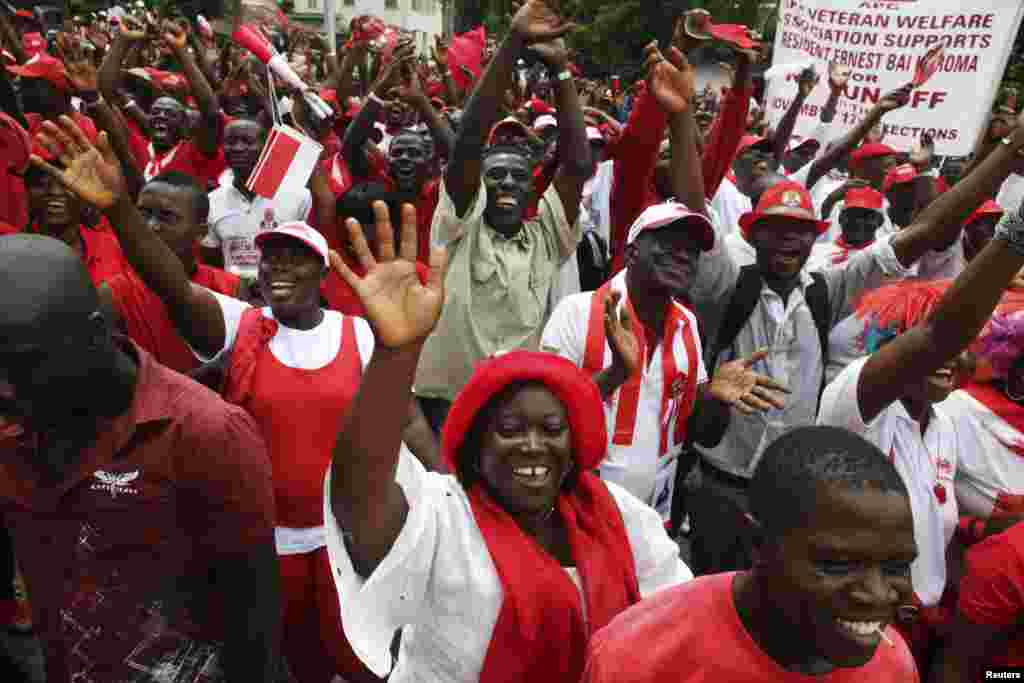 Supporters of the ruling All People's Congress party's President Ernest Bai Koroma attend a rally outside State House in the center of Sierra Leone's capital Freetown, October 11, 2012. 