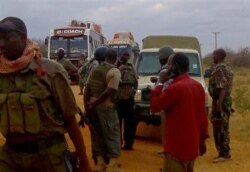 FILE - Kenya army soldiers patrol near attacked buses in Mandera, Kenya, July 1, 2016, after gunmen, thought to be from the al-Shabab group according to a Kenyan official, killed at least six people.
