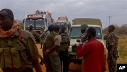 FILE - Kenya army soldiers patrol near attacked buses in Mandera, Kenya, July 1, 2016, after gunmen, thought to be from the al-Shabab group according to a Kenyan official, killed at least six people.