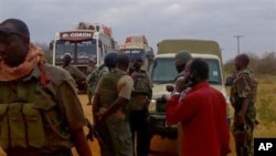 FILE - In an earlier incident, Kenya army soldiers patrol near attacked buses in Mandera, Kenya, July 1, 2016, after gunmen, thought to be from the al-Shabab group according to a Kenyan official, killed at least six people.