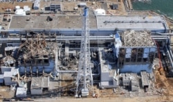 FILE - An aerial view of the damaged Fukushima Daiichi nuclear power plant is seen in Fukushima Prefecture, in this photo taken by Air Photo Service March 24, 2011.