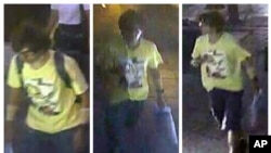 This Aug. 17, 2015, image, released by Royal Thai Police spokesman Lt. Gen. Prawut Thavornsiri shows a man wearing a yellow T-shirt near the Erawan Shrine before an explosion occurred in Bangkok, Thailand. 