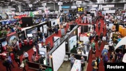 Visitors attend the 2015 Trade Show at the South by Southwest (SXSW) interactive, film and music conference in Austin, Texas, March 15, 2015. 