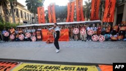 FILE - Activists protest against fossil fuels on the sidelines of the COP28 United Nations climate summit in Dubai on December 5, 2023.