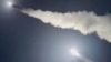 This image was made from a video posted by a Telegram channel affiliated with the Ukrainian military on Nov. 19, 2024. The channel says it shows U.S.-supplied ATACMS missiles being fired from an undisclosed location in Ukraine. (Lachen Pyshe Telegram via AP)