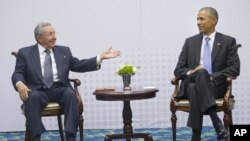 U.S. President Barack Obama, right, meets with Cuban President Raul Castro during the Summit of the Americas in Panama City, Panama, April 11, 2015.