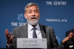 US actor and activist George Clooney speaks at a press conference about South Sudan in London, Thursday, Sept. 19, 2019. The largest multinational oil consortium in South Sudan is "proactively participating in the destruction" of the country, the…