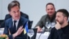 NATO Secretary General Mark Rutte, left, speaks with Ukrainian President Volodymyr Zelenskyy during the NATO-Ukraine Council working dinner at NATO headquarters in Brussels on Oct. 17, 2024.