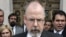FILE - U.S. Attorney John Durham speaks to reporters on the steps of U.S. District Court in New Haven, Conn. 