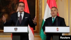 Austria's Vice Chancellor Heinz-Christian Strache and Hungary's Prime Minister Viktor Orban address a news conference at the Hungarian embassy in Vienna, Austria, Jan. 30, 2018. 