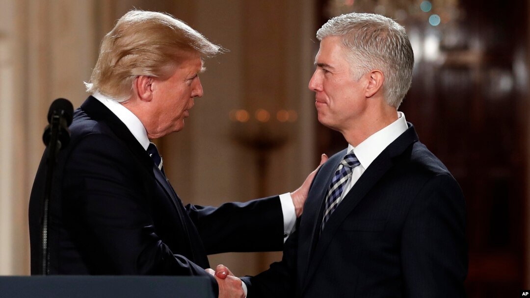 President Donald Trump shakes hands with 10th U.S. Circuit Court of Appeals Judge Neil Gorsuch, his choice for Supreme Court associate justice in the East Room of the White House in Washington, Jan. 31, 2017. 