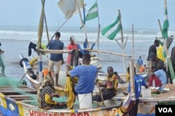 Ghana’s coastline is dotted with canoes and the local fishing industry which rely on them. (S. Knott for VOA)