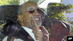 Mohamed Bin Hammam of Qatar is pictured through the window of a limousine upon his arrival at the FIFA headquarters in Zurich, May 29, 2011