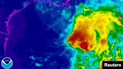 Tropical Storm Karen is seen in a National Oceanic and Atmospheric Administration (NOAA) Geostationary Operational Environmental Satellite East infrared enhanced satellite image taken at 21:45 EST (00:45 GMT) Oct. 4, 2013, and provided by NOAA. 