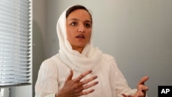 FILE - Zarifa Ghafari, former mayor of Maidan Shahr and an Afghan women's rights activist, speaks during an interview with The Associated Press at a hotel in Duesseldorf, Germany, Aug. 25, 2021.