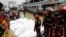 Rescue members bring bodies of victims on a boat after a passenger ferry capsized in the river Buriganga in Dhaka, Bangladesh, June 29, 2020. 