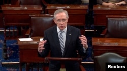 U.S. Senate Majority Leader Harry Reid announces a last-minute deal to avert a historic lapse in the government's borrowing ability, October 16, 2013.