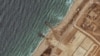 FILE - This handout satellite image courtesy of Maxar Technologies shows the remaining section of the U.S.-built Trident Pier on the coast of the Gaza Strip on May 29, 2024, after bad weather broke it apart. The U.S. said on June 7 that the pier was repaired and ready to be used.