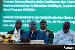 FILE — President of Nigeria and Chairman of ECOWAS Bola Tinubu gives the opening speech during the Extraordinary Session of the Authority of Heads of State and Government on the political, peace and security situation in the sub-region in Abuja, Nigeria, February 24, 2024