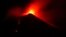 In this photo taken late on Aug. 23, 2018, Mount Etna volcano spews lava during an eruption. 