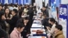 FILE - Students attend a job fair at a vocational and technical school in Hefei, in eastern China's Anhui province on March 3, 2025. 