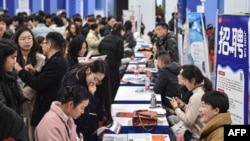 FILE - Students attend a job fair at a vocational and technical school in Hefei, in eastern China's Anhui province on March 3, 2025. 