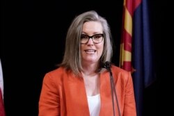 FILE - In this Dec. 14, 2020, file photo, Arizona Secretary of State Katie Hobbs addresses the members of Arizona's Electoral College in Phoenix.