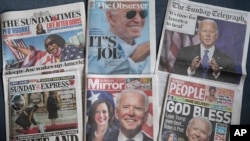 FILE - A selection of the British national newspapers with front page reactions to President-elect Joe Biden and Vice President-elect Kamala Harris prevailing in the U.S. election, is seen in London, Nov. 8, 2020.