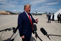 President Donald Trump talks with reporters after arriving at Joint Base Andrews, Sept. 26, 2019, in Maryland.