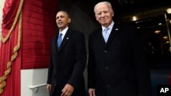 FILE - President Barack Obama and Vice President Joe Biden arrive for the Presidential Inauguration of Donald Trump at the U.S. Capitol in Washington. 