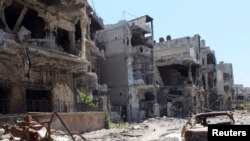 28일 시리아 정부군에 의해 파괴된 시리아 중부 홈스 시 거리.