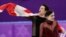 Tessa Virtue and Scott Moir of Canada celebrate during the venue ceremony after winning the gold medal in the ice dance, free dance figure skating final in the Gangneung Ice Arena at the 2018 Winter Olympics in Gangneung, South Korea, Feb. 20, 2018.