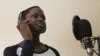 Rapper MC Loy, 13, records rap news to appeal to a younger audience, Kampala, March 20, 2014. (Hilary Heuler/VOA)