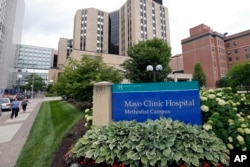 FILE - The Mayo Clinic Hospital, Methodist Campus, center, is pictured Tuesday, July 2, 2019, in Rochester, Minn. (AP Photo/Jim Mone)