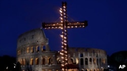 A view of the ancient Colosseum in Rome, April 14, 2017. Pope Francis presided over the Via Crucis (Way of the Cross) torchlight procession on Good Friday in front of Rome's Colosseum. (AP Photo/Alessandra Tarantino) 