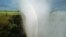 FILE - In this April 1995, file photo, a rainbow forms in a cloud of mist over the Victoria Falls, Zimbabwe. 