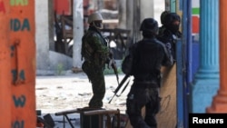 FILE - Kenyan police officers patrol as part of a peacekeeping mission, in Port-au-Prince, Haiti, July 17, 2024. 