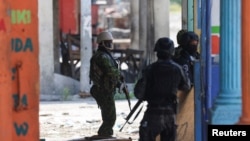 Kenyan police officers patrol as part of a peacekeeping mission, in Port-au-Prince, Haiti, July 17, 2024.