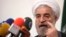 FILE - Iranian presidential candidate Hassan Rowhani, Iran's former top nucslear negotiator, speaks during a campaign rally in Tehran, May 30, 2013.