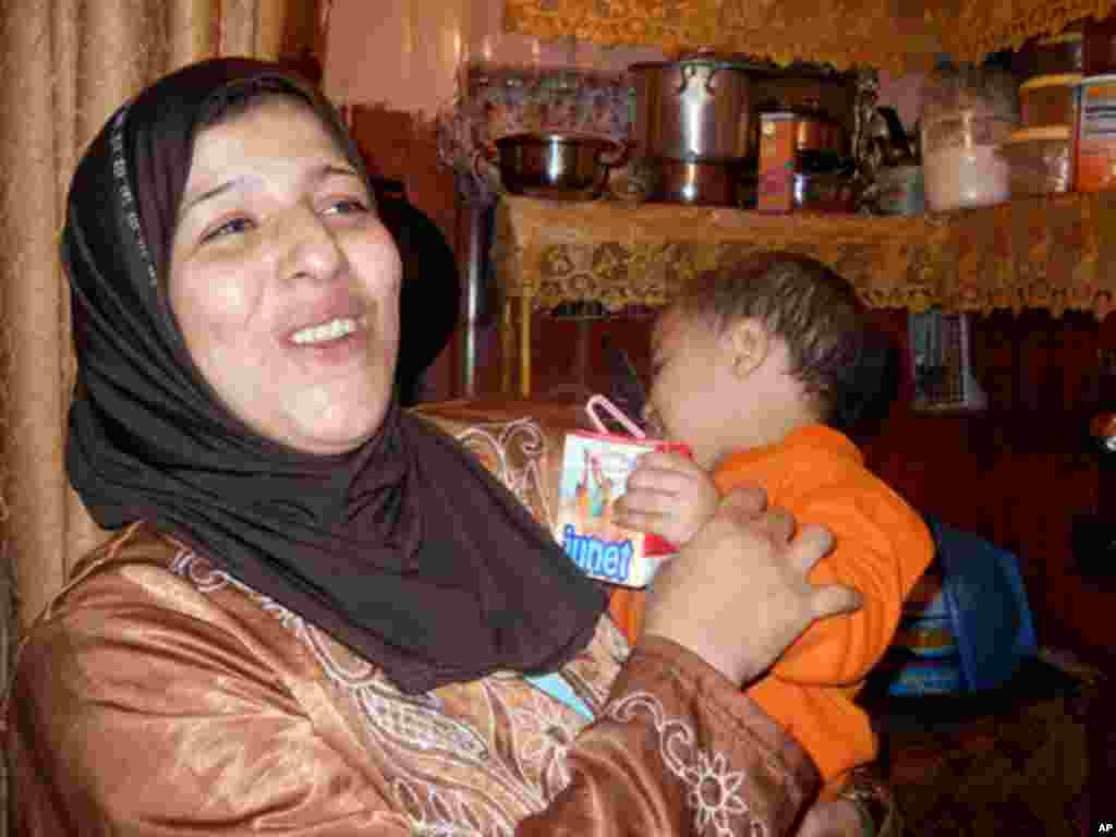 Yazmine lives with her husband and four children in a single room apartment. She says her children are often sick from the stale air in the barracks.
