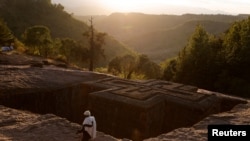 FILE PHOTO: An Ethiopian Orthodox pilgrim walks past the St.George Rock-Hewn church ahead of the Ethiopian Christmas Eve celebration in Lalibela