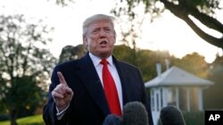 FILE - President Donald Trump speaks to members of the media on the South Lawn of the White House, in Washington, Nov. 4, 2019.