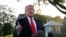 FILE - President Donald Trump speaks to members of the media on the South Lawn of the White House, in Washington, Nov. 4, 2019.