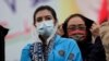 Aseefa Bhutto Zardari, left, a leader of the Pakistan Democratic Movement, an alliance of opposition parties, attends an anti-government rally, in Multan, Pakistan, Monday, Nov. 30, 2020. 