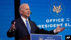 Presiden terpilih Joe Biden berpidato di Queens Theatre, Wilmington, Delaware, 14 Desember 2020.